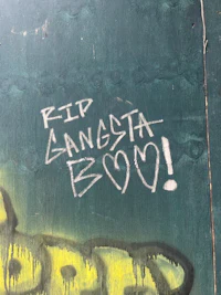 graffiti on a wall that says rip gangsta boo